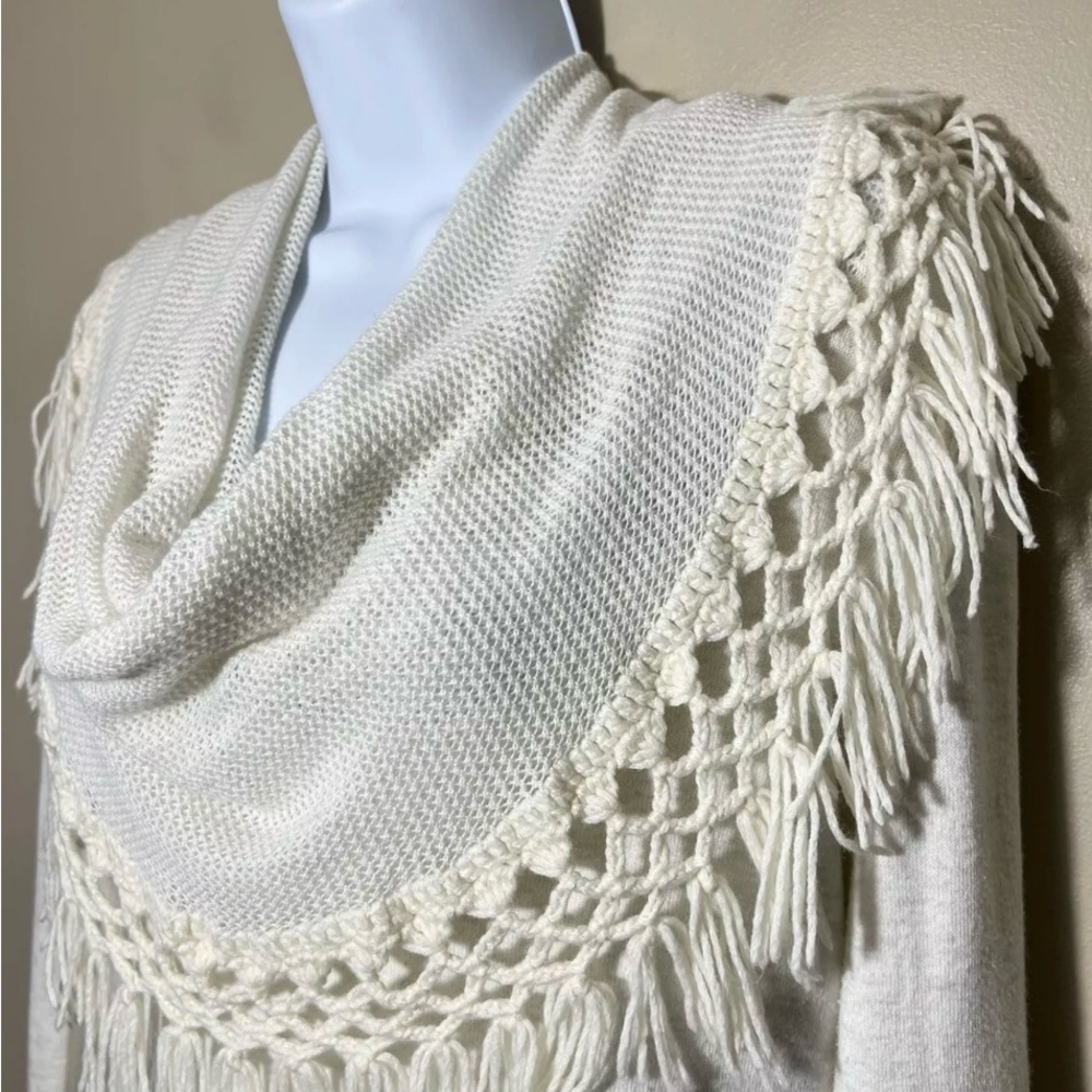 Anthropologie cream color long sleeve with fringe crochet draped‎ collar.